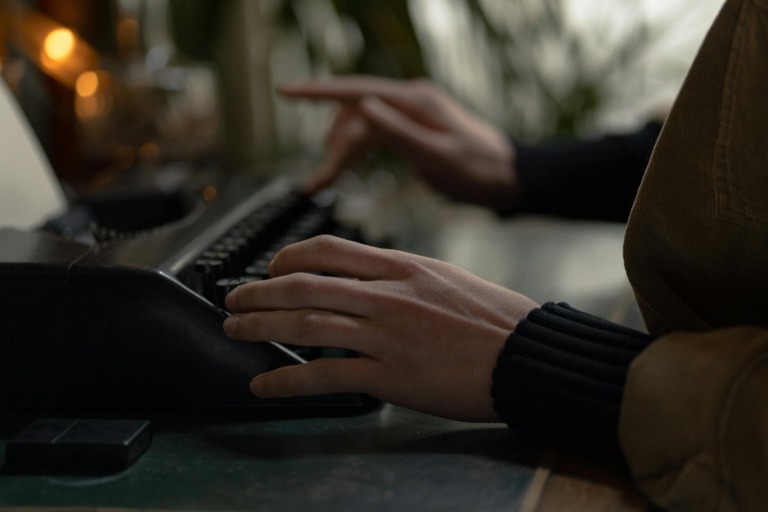 Woman Writing Using a Typewriter